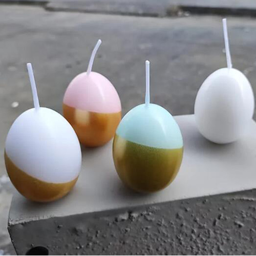 easter egg candles half painted in gold